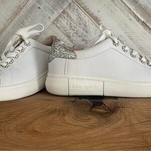 Adorable Kate Spade sneakers with rhinestones and glitter accents.